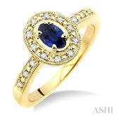 5x3 MM oval cut Sapphire and 1/10 Ctw Round Cut Diamond Ring in 14K Yellow Gold.