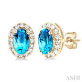 5x3 MM Oval Shape Blue Topaz and 1/8 Ctw Single Cut Diamond Halo Semi-Precious Stud Earrings in 14K Yellow Gold