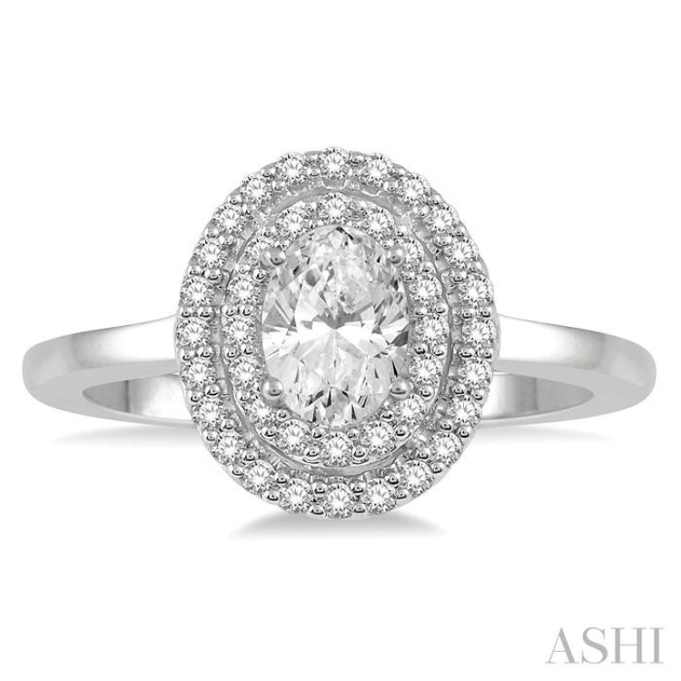 3/4 Ctw Round & Oval Cut Diamond Ladies Engagement Ring with 1/2 Ctw Oval Cut Center Stone in 14K White Gold 3/4 Ctw Round & Oval Cut Diamond Ladies Engagement Ring with 1/2 Ctw Oval Cut Center Stone in 14K White Gold