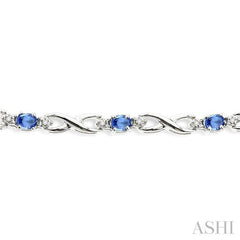 4x3mm Oval Cut Tanzanite and 1/10 Ctw Round Cut Diamond Bracelet in 10K White Gold