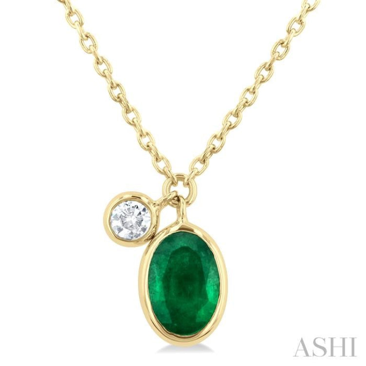 6x4 MM Oval Cut Emerald and 1/20 Ctw Bezel Set Round Cut Diamond Precious Pendant With Chain in 14K Yellow Gold