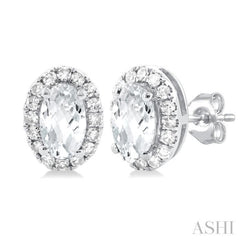 5x3 MM Oval Shape White Topaz and 1/8 Ctw Single Cut Diamond Halo Semi-Precious Stud Earrings in 14K White Gold