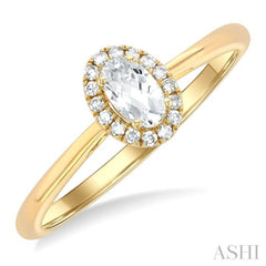 5x3 MM Oval Shape White Topaz and 1/20 Ctw Single Cut Diamond Halo Semi-Precious Ring in 10K Yellow Gold