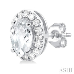 5x3 MM Oval Shape White Topaz and 1/8 Ctw Single Cut Diamond Halo Semi-Precious Stud Earrings in 10K White Gold
