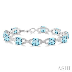 7x7 MM Cushion Shape Blue Topaz and 1/20 Ctw Round Cut Diamond Fashion Bracelet in Sterling Silver