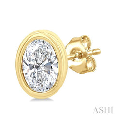 1/5 Ctw Petite Bezel Set Oval Cut Diamond Fashion Stud Earrings in 10K Yellow Gold