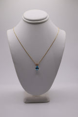 14k yellow gold blue topaz 0.01 ctw diamond pendant